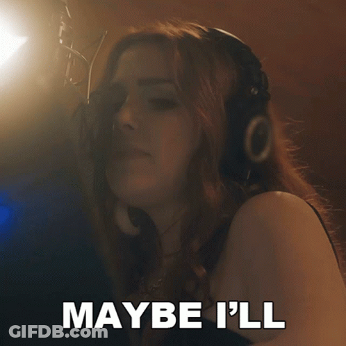A Woman Singing Into A Microphone With The Words Have Some Fun Behind Her GIF