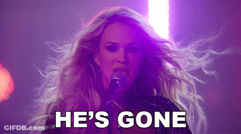 A Woman Singing Into A Microphone With The Words " He 'S Gone " Behind Her GIF