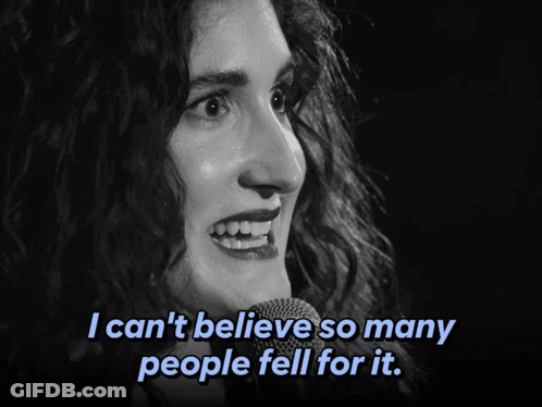 A Woman Singing Into A Microphone With The Words I Can 'T Believe So Many People Fell For It Below Her GIF