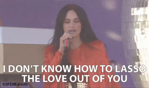 A Woman Singing Into A Microphone With The Words " I Don 'T Know How To Lasso The Love Out Of You " GIF