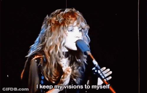 A Woman Singing Into A Microphone With The Words " I Keep My Visions To Myself " Below Her GIF