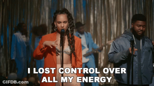 A Woman Singing Into A Microphone With The Words " I Lost Control Over All My Energy " Behind Her GIF