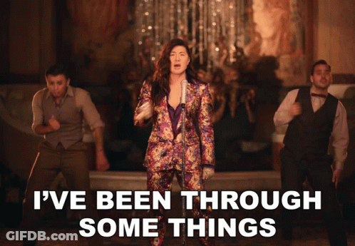 A Woman Singing Into A Microphone With The Words " I 'Ve Been Through Some Things " Below Her GIF