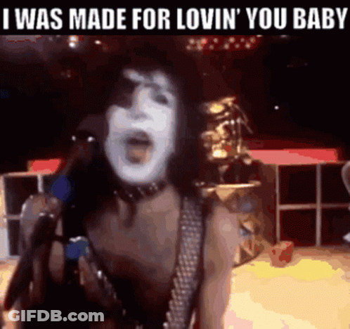 A Woman Singing Into A Microphone With The Words " I Was Made For Lovin ' You Baby " Above Her GIF