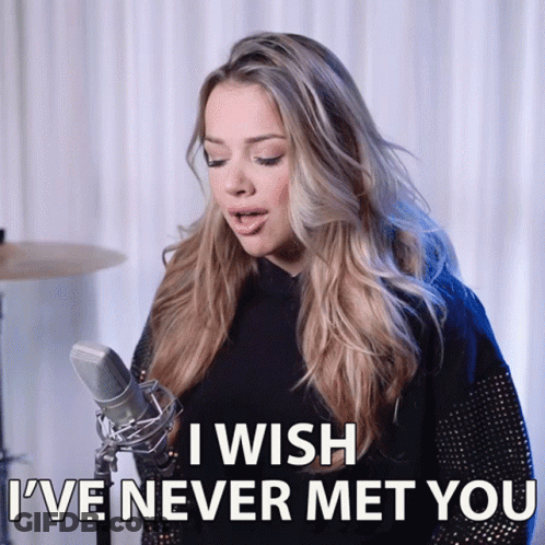 A Woman Singing Into A Microphone With The Words " I Wish I 'Ve Never Met You " Above Her GIF