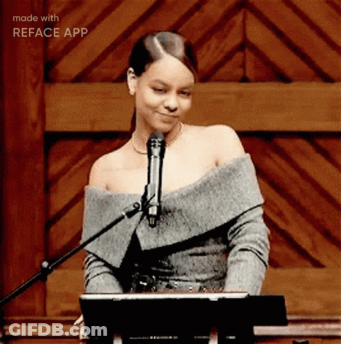 A Woman Singing Into A Microphone With The Words Made With Reface App Visible GIF