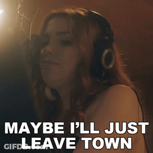 A Woman Singing Into A Microphone With The Words Maybe I 'Ll Just Leave Town On The Bottom GIF