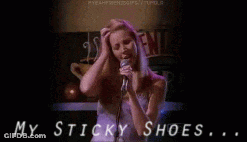 A Woman Singing Into A Microphone With The Words My Sticky Shoes GIF