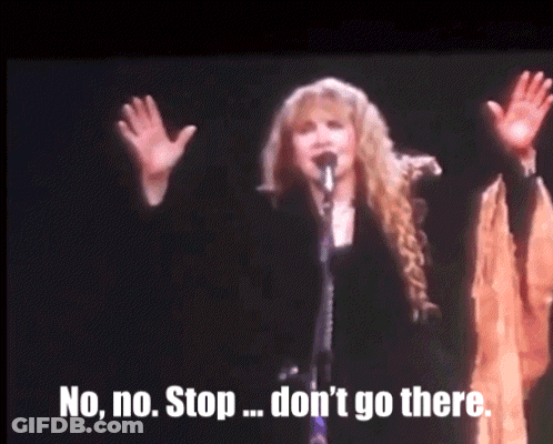 A Woman Singing Into A Microphone With The Words " No No Stop ... Don 'T Go There " Below Her GIF