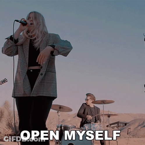Woman Singing Into Microphone With Open Myself Text GIF