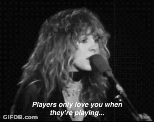A Woman Singing Into A Microphone With The Words `` Players Only Love You When They 'Re Playing ... '' GIF