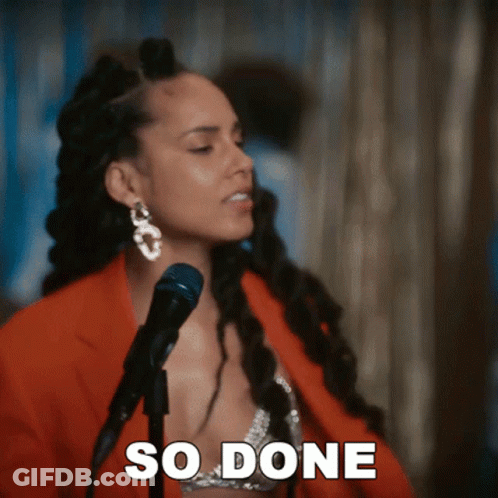 A Woman Singing Into A Microphone With The Words So Done Written On The Bottom GIF