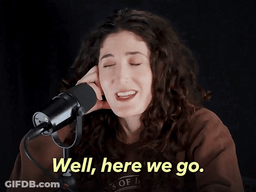A Woman Singing Into A Microphone With The Words " Well Here We Go " Above Her GIF