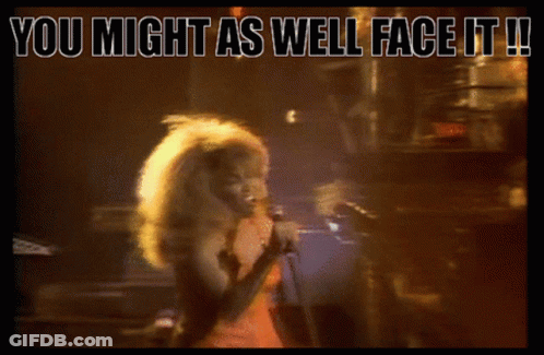 A Woman Singing Into A Microphone With The Words " You Might As Well Face It " Below Her GIF