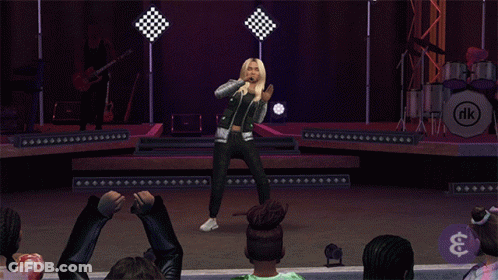 A Woman Singing On A Stage In Front Of A Drum Set That Says Rk GIF