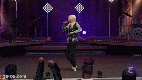 A Woman Singing On A Stage With A Band Behind Her And A Dollar Sign GIF