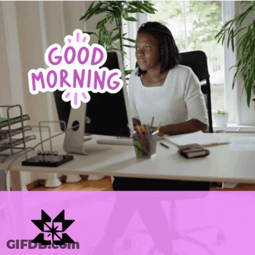 A Woman Sits At A Desk In Front Of A Computer With The Words Good Morning Written On It GIF