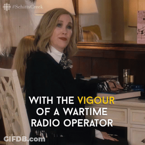 A Woman Sits At A Desk With The Words " With The Vigour Of A Wartime Radio Operator " GIF
