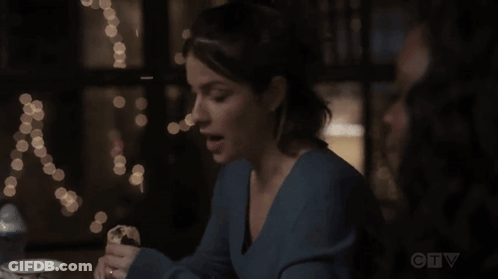 A Woman Sits At A Table With A Cup Of Coffee And A Ctv Logo In The Corner GIF