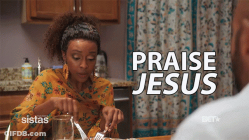 A Woman Sits At A Table With A Knife And Fork And The Words Praise Jesus Above Her GIF