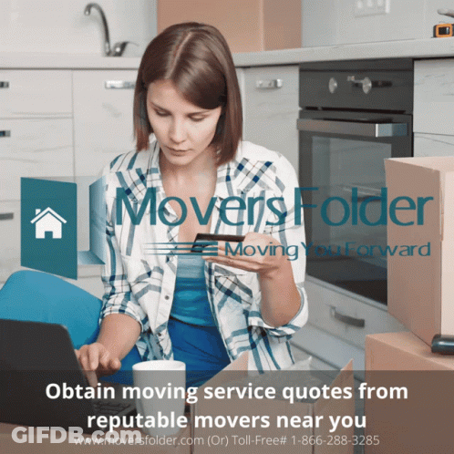 A Woman Sits At A Table With A Laptop And A Credit Card In Front Of A Sign That Says Movers Folder GIF