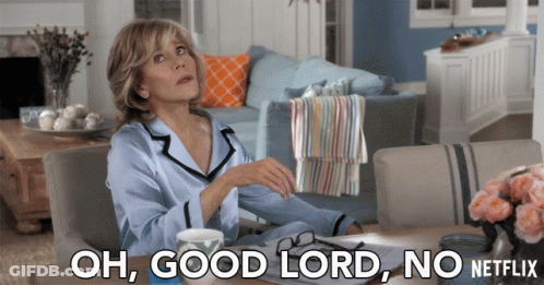 A Woman Sits At A Table With The Words Oh Good Lord No Netflix Written Below Her GIF