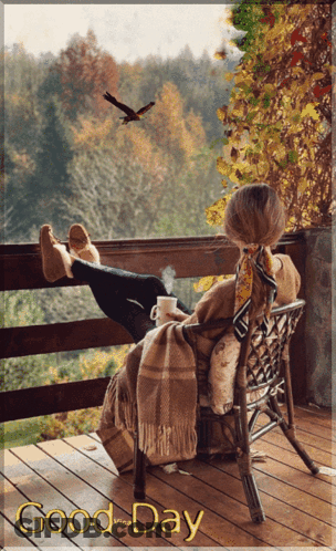 A Woman Sits In A Chair On A Balcony With A Cup Of Coffee And The Words " Good Day " Above Her GIF
