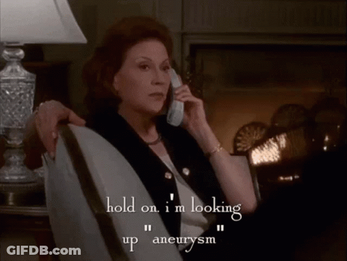 A Woman Sits In A Chair Talking On A Cell Phone And The Words In Our Medical Dictionary To See If I Just Had One GIF