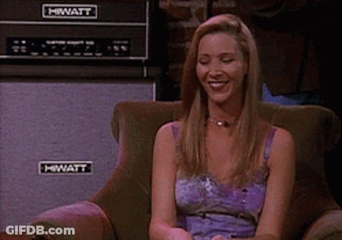 A Woman Sits In A Chair With A Hiwatt Amplifier In The Background GIF