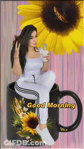 A Woman Sits In A Cup With The Words Good Morning Written On It GIF