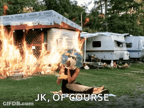 A Woman Sits In Front Of A Burning Trailer With The Words " Jk Of Course " Written Below Her GIF