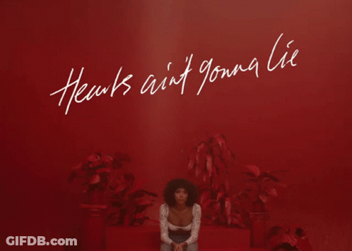 Woman Sitting In Front Of Red Wall Hearts Ain't Gonna Lie GIF