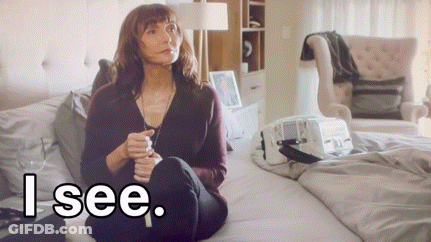 A Woman Sits On A Bed With The Words " I See " Written Below Her GIF