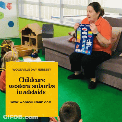A Woman Sits On A Couch Holding A Poster That Says First Calendar GIF