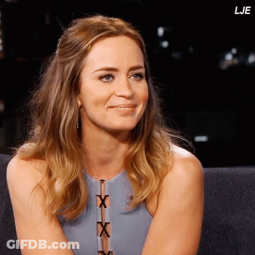 A Woman Sits On A Couch With The Letters Lje On The Bottom Right GIF