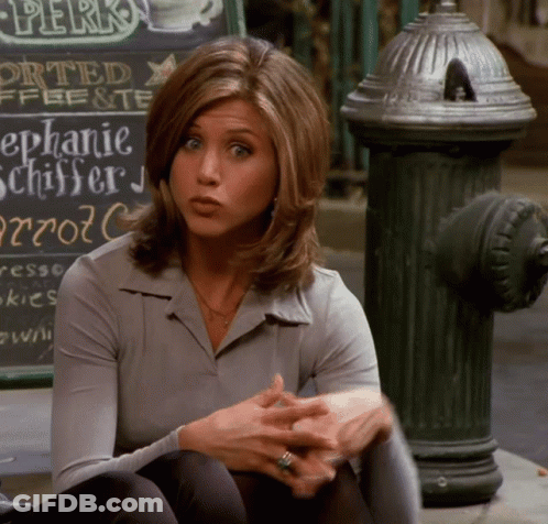 A Woman Sits On The Sidewalk In Front Of A Sign That Says " Perks " GIF