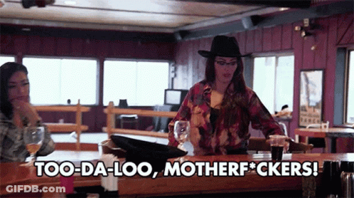 A Woman Sitting At A Bar With The Words Too-Da-Loo Motherfuckers GIF