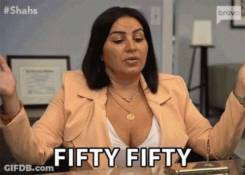 A Woman Sitting At A Desk Says Fifty Fifty With Her Hands In The Air GIF