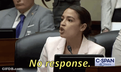 A Woman Sitting At A Desk With A Sign That Says C-Span 40 Years GIF