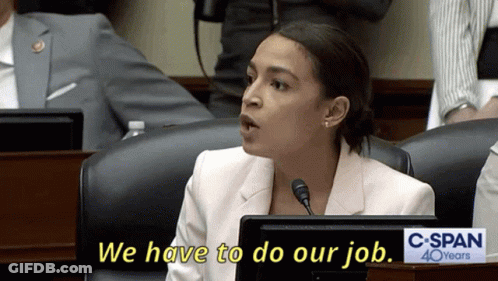 A Woman Sitting At A Desk With A Sign That Says C Span 40 Years GIF