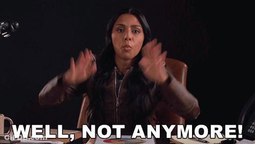 A Woman Sitting At A Desk With Her Hands In The Air And The Words Well Not Anymore GIF