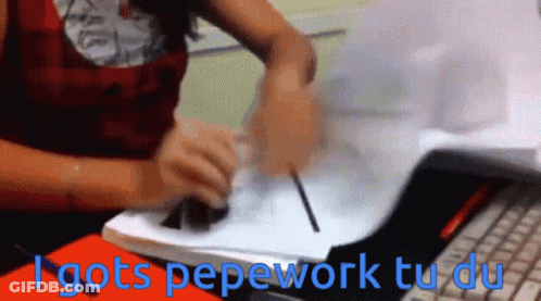 A Woman Sitting At A Desk With The Words " I Gots Pepework Tu Du " On The Bottom GIF