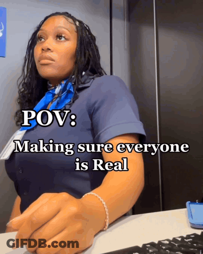 A Woman Sitting At A Desk With The Words Pov Making Sure Everyone Is Real On The Bottom GIF