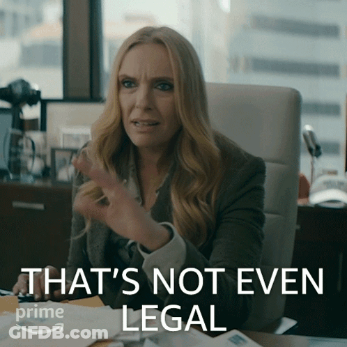 A Woman Sitting At A Desk With The Words That 'S Not Even Legal Written On The Bottom GIF