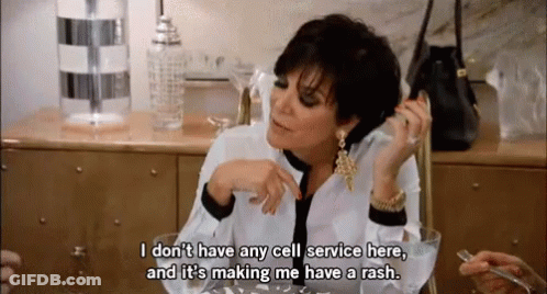 A Woman Sitting At A Table Talking On A Cell Phone And Saying " I Don T Have Any Cell Service Here " GIF