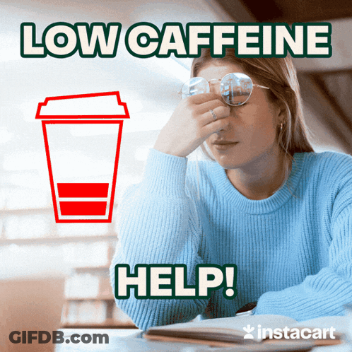 A Woman Sitting At A Table With A Cup Of Coffee Next To Her And The Words Low Caffeine Help GIF