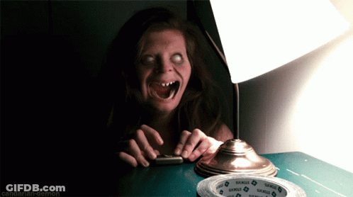 A Woman Sitting At A Table With A Lamp And A Roll Of Samuel 'S Tape On It GIF