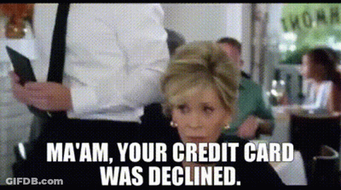 A Woman Sitting At A Table With A Man Holding A Credit Card And A Caption That Says Ma 'Am GIF