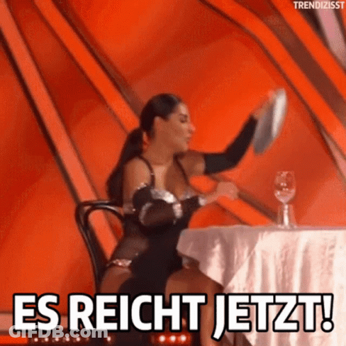 A Woman Sitting At A Table With A Plate In Her Hand And The Words Es Reicht Jetzt GIF