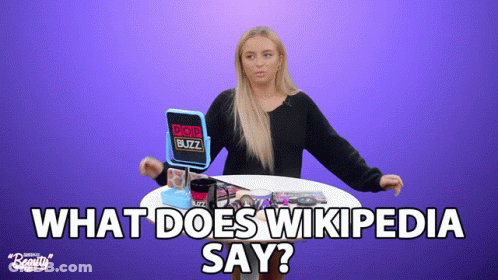 A Woman Sitting At A Table With A Pop Buzz Mirror GIF